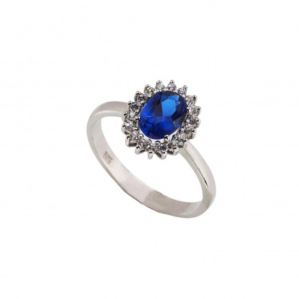 Δαχτυλίδι από λευκόχρυσο Κ14 με μπλε πέτρα και ζιργκόν πέτρες.
